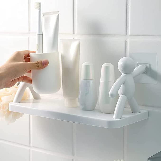 Young couple standing on a wooden shelf in a spacious bathroom surrounded by toiletries and personal items.