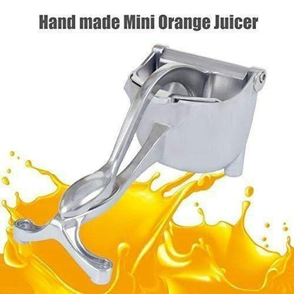 Handmade orange ceramic mini juicer with intricate design and smooth curves on a white background.