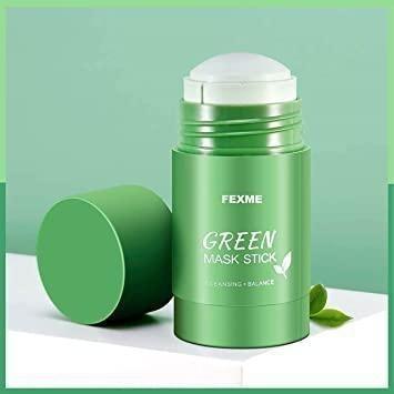a green mask stick next to a green container.