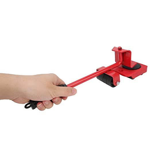 A red tool with a matching handle is held by a hand in a tightly gripped position. The tool's purpose and the hand's identity remain unknown. The background is blurred, providing no contextual information.
